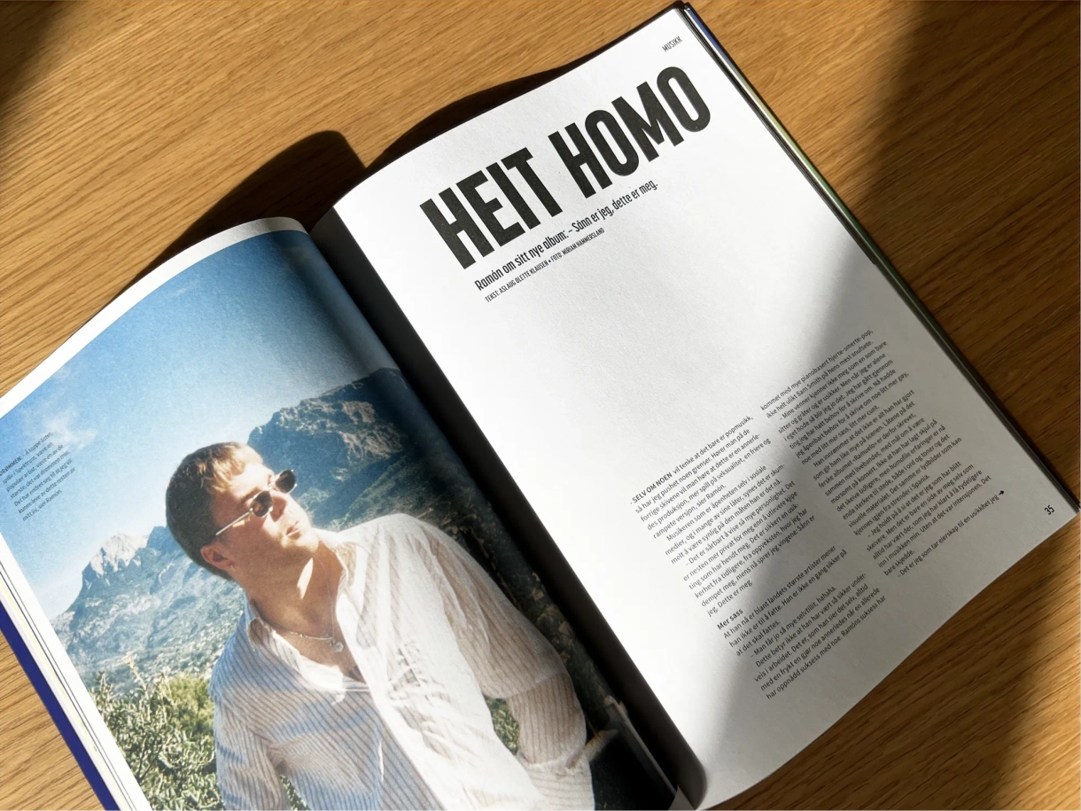 Oppslag i magasinet med overskriften «Heit homo» og et portrettbilde av en mann med solbriller foran et fjellandskap